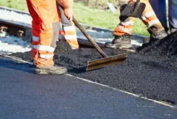 Spreading New Driveway Asphalt